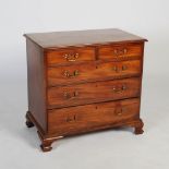 A George III mahogany chest of drawers of neat proportions, the rectangular top with moulded edge