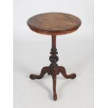 A 19th century rosewood occasional table, the circular top with moulded edge, raised on a tapered