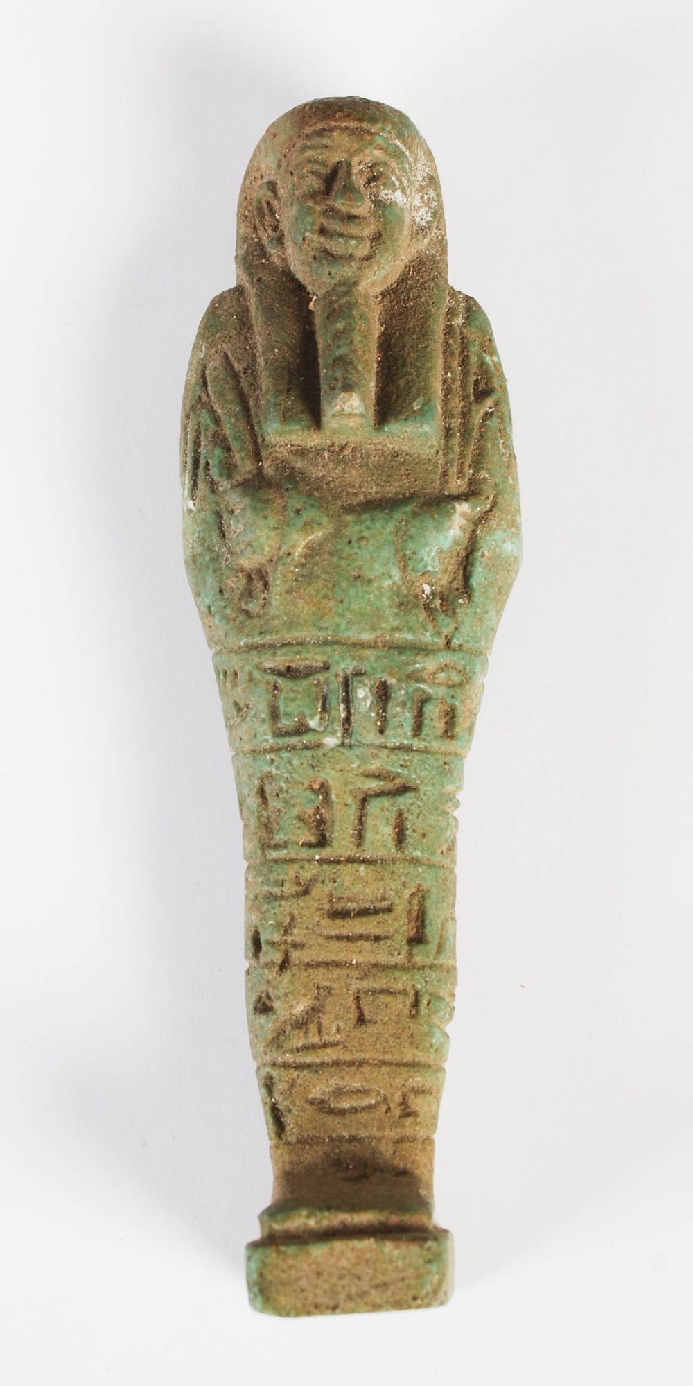 Antiquities- An Ancient Egyptian green glazed faience shabti, circa Late Period, with incised