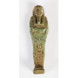 Antiquities- An Ancient Egyptian green glazed faience shabti, circa Late Period, with incised