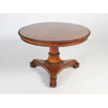An early 19th century Scottish Regency rosewood snap top centre table, the hinged circular top