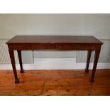 A 19th century mahogany console table, the rectangular top above an arcaded frieze, raised on four
