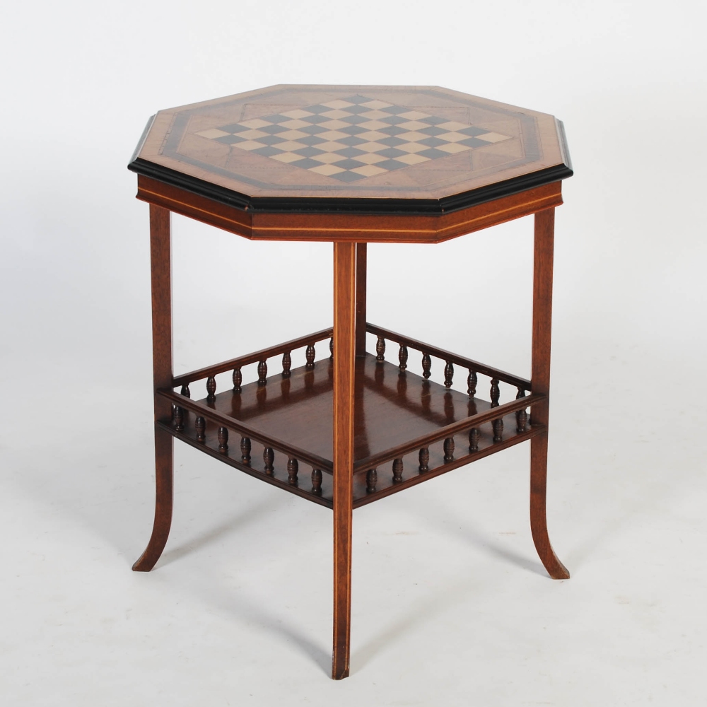 A 19th century octagonal shaped rosewood, walnut and specimen wood inlaid games table in the