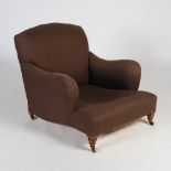 A late 19th/early 20th century walnut armchair by Howard & Sons, London, the upholstered back,