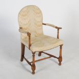 An early 20th century child's mahogany armchair, the arched back, shaped arms and seat upholstered