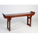 A Chinese dark wood rectangular table, late Qing Dynasty, the rectangular top with upright scroll