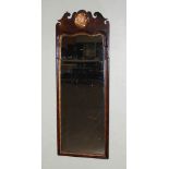 A George II style mahogany and parcel gilt fret cut wall mirror, with pierced and carved Prince Of
