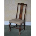 A late 19th/early 20th century beech wood side chair, the rectangular back with scroll top rail
