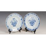 A pair of Chinese porcelain blue and white plates, Qing Dynasty, decorated with ribbon tied