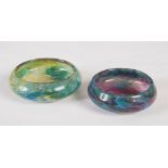Two small Monart dishes/ pin trays, shape Y, one mottled blue, green and purple, 9cm diameter, the