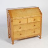 Mouseman - a carved oak bureau, the hinged fall front opening to a fitted interior with six open