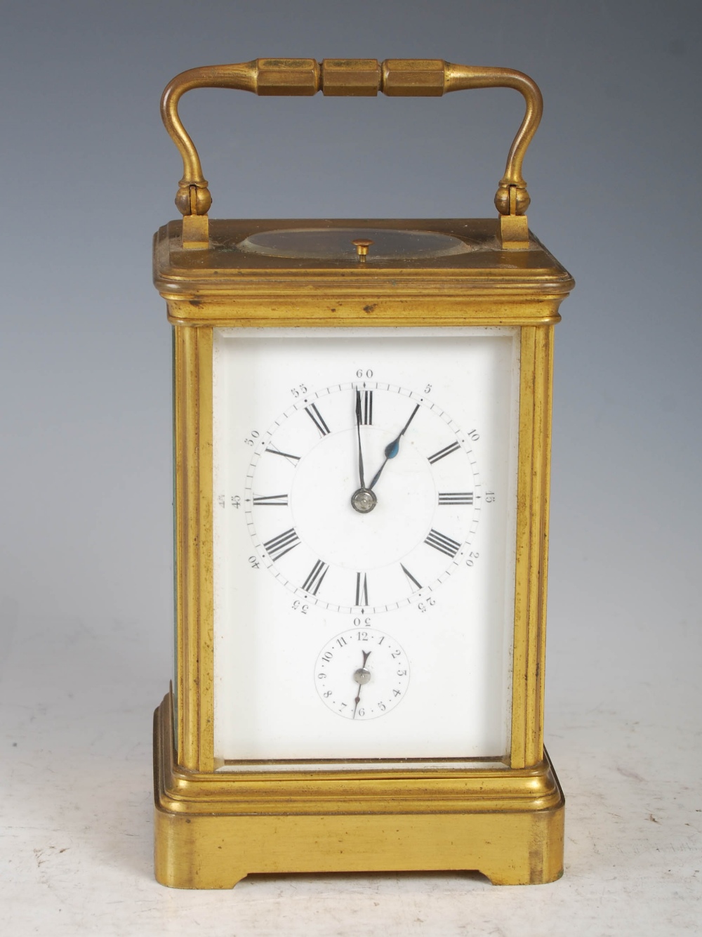 A 19th century brass cased repeater carriage clock with alarm, the white enamel dial with Arabic and