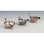 Three late 19th/ early 20th century silver sauce boats, comprising; a Victorian silver sauce boat,