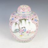 A Chinese porcelain pink ground jar and cover, early 20th century, decorated with shaped panels of