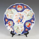 A late 19th/early 20th century Japanese porcelain Imari dish, decorated with central roundel of