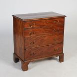 A George III mahogany bachelors chest, the rectangular top with moulded edge above three long