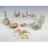Antiquities- A collection of Ancient Roman glass, to include; an iridescent green tinted bottle