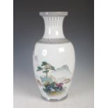 A Chinese porcelain vase, Republic Period, decorated with pavilions and pine trees in a mountain