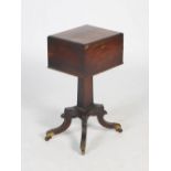 A 19th century rosewood and gilt metal mounted tea poy, the hinged rectangular top opening to a