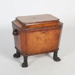 A 19th century mahogany sarcophagus shaped bottle stand, the hinged cover opening to a fitted