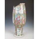 A Chinese porcelain famille rose Canton vase, Qing Dynasty, decorated with panels of court figures