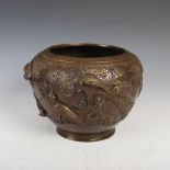 A Chinese bronze jardiniere, late 19th/early 20th century, cast in relief with birds and prunus