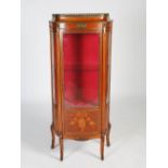 A late 19th century French mahogany, marquetry and gilt metal mounted vitrine, the shaped top with a
