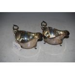 PAIR OF BIRMINGHAM SILVER SAUCE BOATS WITH REEDED RIMS AND THREE HOOF FEET