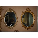 CREAM AND GILT ROCOCO STYLE WALL MIRROR, TOGETHER WITH ANOTHER GILT ROCOCO STYLE WALL MIRROR