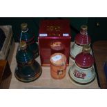 FIVE BELLS WHISKY COMMEMORATIVE DECANTERS TOGETHER WITH A BELLS COMMEMORATIVE MINIATURE IN BOX