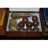 ROSEWOOD TRINKET BOX CONTAINING A BRASS SHOT FLASK, SET OF CARPET BOWLS AND BRASS OWL FIGURE