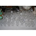 LARGE COLLECTION OF ASSORTED CRYSTAL INCLUDING LOT OF CRYSTAL STEMMED SHERRY GLASSES, ETCHED LIQUEUR