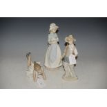LLADRO PORCELAIN FIGURE OF A FISHER BOY, TOGETHER WITH TWO NAO PORCELAIN FIGURES - GIRL AND PUPPY