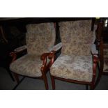 PAIR OF BEIGE AND FLORAL PATTERNED UPHOLSTERED LOUNGE EASY CHAIRS
