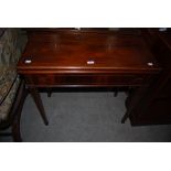 A 19TH CENTURY MAHOGANY INLAID GAMES TABLE ON SQUARE TAPERED LEGS
