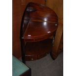 A 19TH CENTURY MAHOGANY CORNER WASH STAND CONVERTED TO A TABLE WITH THREE FRIEZE DRAWERS