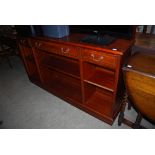 REPRODUCTION MAHOGANY OPEN BOOKCASE WITH ADJUSTABLE SHELVES AND THREE FRIEZE DRAWERS