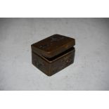LATE 19TH CENTURY JAPANESE BRONZE RECTANGULAR SHAPED BOX AND COVER, DECORATED IN RELIEF WITH RUNNING