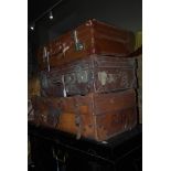 TWO VINTAGE LEATHER SUITCASES AND A BROWN LEATHERETTE SUITCASE