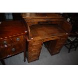 EARLY 20TH CENTURY OAK PEDESTAL ROLL TOP DESK WITH D-SHAPED TAMBOUR SHUTTER