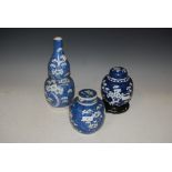 A 19TH CENTURY CHINESE PORCELAIN BLUE AND WHITE GOURD SHAPED VASE DECORATED WITH PRUNUS, TOGETHER
