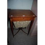 A 19TH CENTURY MAHOGANY INLAID SEWING TABLE ON SQUARE TAPERED LEGS WITH CROSS STRETCHER
