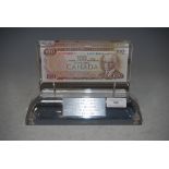 PERSPEX CASED BANK OF CANADA 100 DOLLAR BANK NOTE, INSCRIBED ON PLINTH 'TO ARCHIE BLACK FOR HAVING