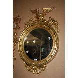 REPRODUCTION REGENCY STYLE CIRCULAR WALL MIRROR WITH BALL SET FRIEZE AND EAGLE SURMOUNT