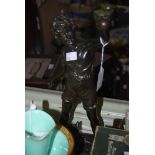 BRONZED SPELTER FIGURE OF A YOUNG BOY WITH BAT AND BALL, SIGNED ON BASE