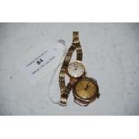 VINTAGE LADIES TISSOT 9CT GOLD CASED WRIST WATCH WITH CHAMPAGNE COLOURED DIAL AND ARABIC NUMERALS,