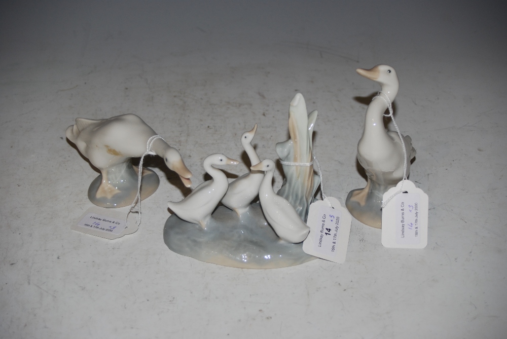 TWO LLADRO GEESE FIGURES AND A NAO TRIPLE GOOSE FIGURE GROUP