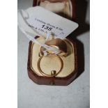 AN 18CT GOLD WEDDING RING AND A 9CT GOLD SIGNET RING