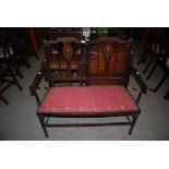 EDWARDIAN MAHOGANY INLAID PARLOUR TWO SEATER SETTEE WITH STUFFOVER SEATS SUPPORTED ON TURNED LEGS