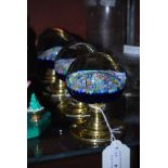 FOUR BLUE GROUND MILLIFIORI GLASS AND BRASS DOOR KNOBS